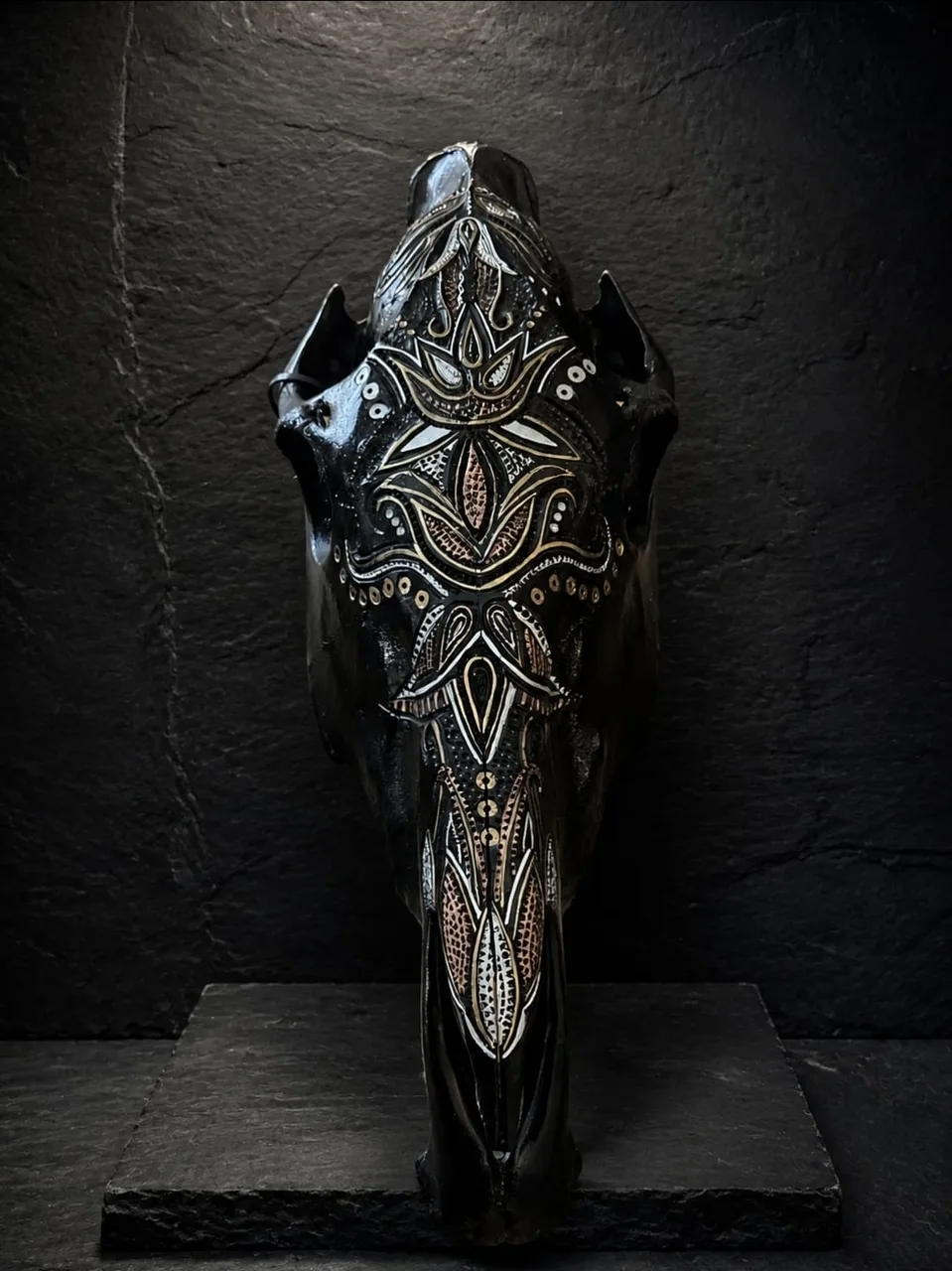 Zebra skull painted black with ornate white and copper mandala detail down the face